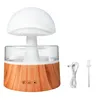 A mushroom-shaped humidifier with a wood-grain base, shown with its USB charging cable and a small cleaning brush. Náhled obrázku produktu