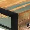 A close-up view of a wooden desk with a distressed finish and black metal accents. Anteprima dell’immagine prodotto