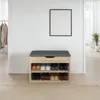A shoe bench with storage shelves is shown in a hallway or entryway. Náhled obrázku produktu