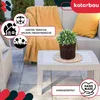 An outdoor living space with furniture and a plant. Produktbild-Vorschau