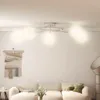 A living room scene with a sofa, a tapestry, and a ceiling light. Náhľad obrázku produktu