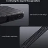 Close-up shots of a black phone case highlighting its texture and lanyard hole. Náhled obrázku produktu