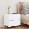 A white floating nightstand with two drawers is shown next to a bed with a wooden headboard. Produktbild-Vorschau
