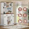 A white and brown kitchen sideboard with glass cabinet doors and drawers, displayed in a room with a rug and a window in the background. Overlay graphics highlight various storage uses. Podgląd zdjęcia produktu