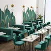 A modern restaurant or cafe interior with plush seating and decorative wall panels. Anteprima dell’immagine prodotto