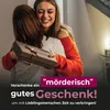 Two women hugging, one is giving a gift to the other. Produktbild-Vorschau
