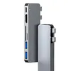Two silver USB-C hubs are shown against a white background. One hub is in the foreground, and the other is behind it and slightly to the left. Voir les images du produit