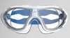 A front view of white and blue Speedo swimming goggles against a light gray background. Voir les images du produit
