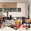 A collection of kitchen appliances and food items arranged on a countertop in a modern kitchen setting. Anteprima dell’immagine prodotto