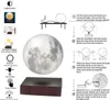 An instructional diagram showing how to set up and use a levitating moon lamp, with a large image of the moon lamp itself. Produktbild-Vorschau