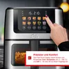 A hand is shown interacting with the touch screen of a Solis air fryer, which displays various cooking presets. Produktbild-Vorschau