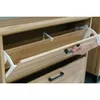 A hand is opening a drawer on a wooden cabinet. Anteprima dell’immagine prodotto