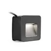 A dark gray square wall-mounted light fixture with a light emanating from its opening, set against a white background. Produktbild-Vorschau