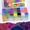 A storage case filled with colorful loom bands and accessories, with a partial view of more loom bands in the foreground. Náhled obrázku produktu
