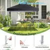 A pop-up gazebo set up in a backyard with a table and chairs underneath. Produktbild-Vorschau