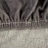 A close-up view of a grey fabric with white stitching. Produktbild-Vorschau