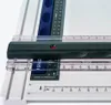 A close-up view of a drafting board with rulers and measurement markings. Anteprima dell’immagine prodotto