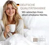 A woman in bed holding a coffee cup, with text and a logo. Produktbild-Vorschau