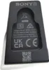 A close-up view of the back of a black Sony charging hanger with various labels and symbols. Voir les images du produit