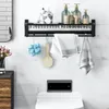 A modern bathroom with a shelf holding toiletries, towels, and bath accessories above a toilet with a bidet control panel. Produktbild-Vorschau