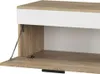 A close-up view of an open cabinet door on a piece of furniture. Produktbild-Vorschau