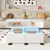 A modern living room scene featuring a white coffee table with LED lighting, a sofa, and decorative items. Produktbild-Vorschau