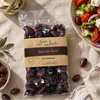 Gaia Kallisti Kalamata-Oliven Vakuumbeutel neben Bauernsalat Produktbild-Vorschau