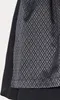 A close-up view of a black fabric with a repeating pattern. Produktbild-Vorschau