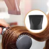 A close-up of someone styling hair with a round brush and a hairdryer nozzle. Produktbild-Vorschau