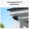 A security camera mounted on the exterior wall of a building, with Wi-Fi signal waves emanating from it. Produktbild-Vorschau