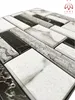 A close-up, angled view of self-adhesive wall panels with a marble and stone-like pattern. Náhled obrázku produktu
