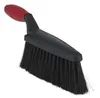 A black and red snow brush with black bristles, shown against a white background. Voir les images du produit