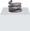 A coiled gray pipe insulation is shown resting on a white cube. Podgląd zdjęcia produktu