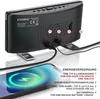 The back of a black digital alarm clock is shown, with cables connected to it and a smartphone charging in the foreground. Text overlays describe the power supply and connections. Náhled obrázku produktu