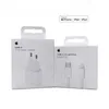 Two white boxes of Apple charging accessories, a power adapter and a cable, are displayed side-by-side against a white background. Produktbild-Vorschau