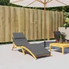 An outdoor patio scene with two lounge chairs, a table, and an umbrella. Podgląd zdjęcia produktu