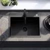A top-down view of a black kitchen sink with a black faucet, set into a gray countertop. Náhled obrázku produktu