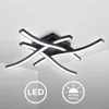 A modern black ceiling light with curved LED elements is shown against a white ceiling. Produktbild-Vorschau