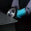 A close-up shot of a person wearing gloves using an angle grinder to cut a tile. Voir les images du produit
