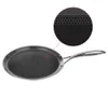 A close-up view of a non-stick frying pan with a honeycomb pattern, shown from a side angle against a white background. A magnified inset highlights the texture of the pan's surface. Voir les images du produit