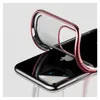 A close-up shot of a transparent phone case with a rose gold metallic edge, shown on a black iPhone. Produktbild-Vorschau