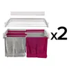 A white wall-mounted drying rack with two towels hanging on it, and a "x2" graphic on the right. Produktbild-Vorschau