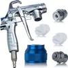 A collection of parts for a spray machine, including the main gun, various nozzles, and a blue adapter. Anteprima dell’immagine prodotto