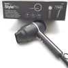 A black Beurer StylePro compact hair dryer is shown next to its packaging. Podgląd zdjęcia produktu