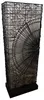 A tall, rectangular floor lamp with a black wire frame and a white fabric shade. The wire frame has a decorative fan-like pattern on one side and a circular pattern on the other. The lamp stands on a black rectangular base. Náhled obrázku produktu