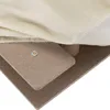 A close-up view of the layered construction of a pet stair, showing the plush fabric, particle board layers, and a metal fastener. Náhled obrázku produktu