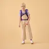 A young girl wearing overalls and a backpack, posing against a plain background. Produktbild-Vorschau