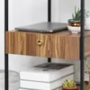A close-up of a wooden shelf with a drawer, a laptop, and potted plants. Produktbild-Vorschau