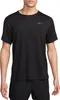 A man wearing a black Nike t-shirt and black shorts. Podgląd zdjęcia produktu