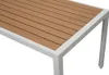 A close-up view of a table with a wooden top and white frame. Produktbild-Vorschau